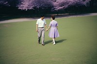 Old couple dating in park footwear outdoors walking.