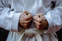 Male karate fighter hands finger midsection strength.