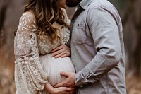 Husband kissing baby bump adult togetherness anticipation. AI generated Image by rawpixel.