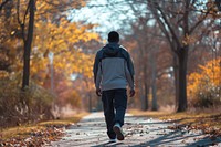 African American walking autumn nature.