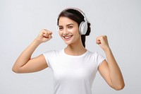 Positive woman showing arm muscle with headphone headphones headset smile.
