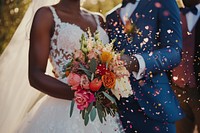 Happy American African couple at wedding ceremony flower dress bride.