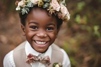 Happy black flower boy wedding portrait bride.