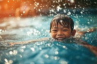 Kid swimming bathing sports happy. 