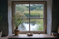 Window see river windowsill plant room.