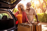 Elder African american couple luggage holiday baggage.