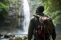 Middle age african american backpacker waterfall outdoors nature.