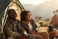 Middle age african american couple mountain outdoors sitting.