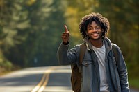 African American teen man travel forest smile.
