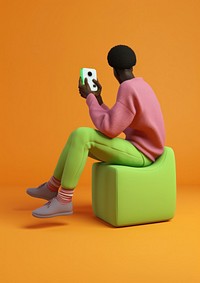 A black man sitting holding joystick furniture footwear cartoon. AI generated Image by rawpixel.
