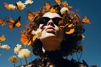 Women with butterfly flower photography sunglasses.