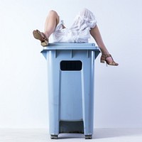 Legs lying on a trash can adult portrait barefoot.