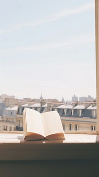 Book sitting on the window paris view publication architecture transparent. AI generated Image by rawpixel.