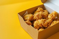 Fried popcorn chicken in box fried food container. AI generated Image by rawpixel.