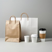 Craft paper and recycled plastic cover and blank label food delivery packages handbag coffee cup.