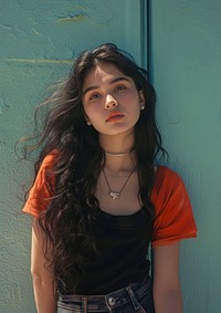 Latinx young girl necklace fashion contemplation.