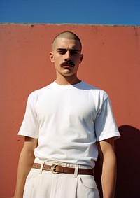 Mexican man skinhead with Mustache standing fashion sports.