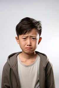 Young chinese boy crying portrait worried. AI generated Image by rawpixel.