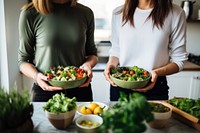 Hand holding food kitchen salad. AI generated Image by rawpixel.