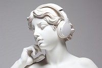 Listening to music sculpture statue female.