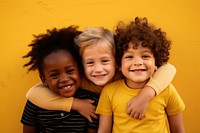 3 inclusivity kid laughing portrait yellow. AI generated Image by rawpixel.