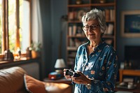 Woman holding a game controller glasses adult photo. AI generated Image by rawpixel.