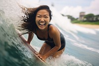  Singaporean woman surfing recreation laughing. AI generated Image by rawpixel.