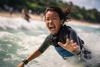  Singaporean woman surfing recreation laughing. AI generated Image by rawpixel.