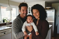 Mixed race baby portrait holding.
