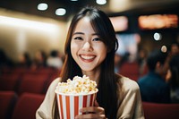 Popcorn smiling holding adult. AI generated Image by rawpixel.