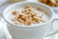 Cereal in milk drink food bowl.