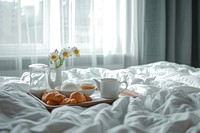 Breakfast tray on hotel bed furniture blanket bedroom.