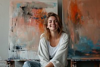 Woman sitting on a chair laughing portrait smiling.