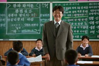 Korea teacher teaching a classroom of students adult child togetherness.