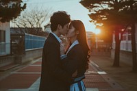 Photo of korean highschool student couple kissing outdoors adult love.