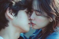 Photo of korean young adult couple kissing portrait love affectionate.