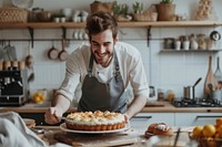 Man baking a cake kitchen smiling person.