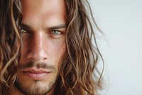 Brunette man with long wavy hair portrait skin photography.