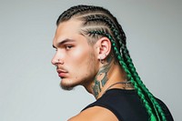 European young man with vivid green black braids hair portrait fashion tattoo.