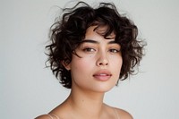 Hispanic young woman with short curly cut hair portrait photography fashion.