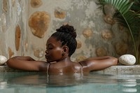 Nigerian woman bathing day relaxation.