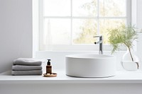 Scandinavian interior design of a bathroom windowsill bathtub sink.