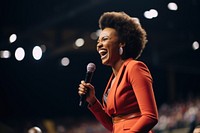 Black woman speaker on professional stage microphone smiling adult.