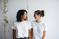 2 women in different races laughing smile adult.