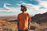 Indian american man t-shirt outdoors desert.