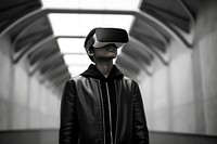Indian teenager wearing vr glasses architecture technology monochrome.