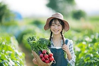 A happy japanese girl farmer holding vegetables outdoors organic smile.