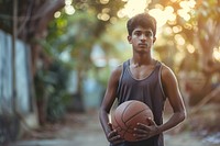Sri Lankan young man playing sports and hobby basketball day contemplation.