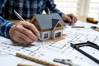 A architect inspecting an construction home diagram adult craftsperson.