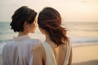 Taiwanese lesbian couple happy portrait beach outdoors.